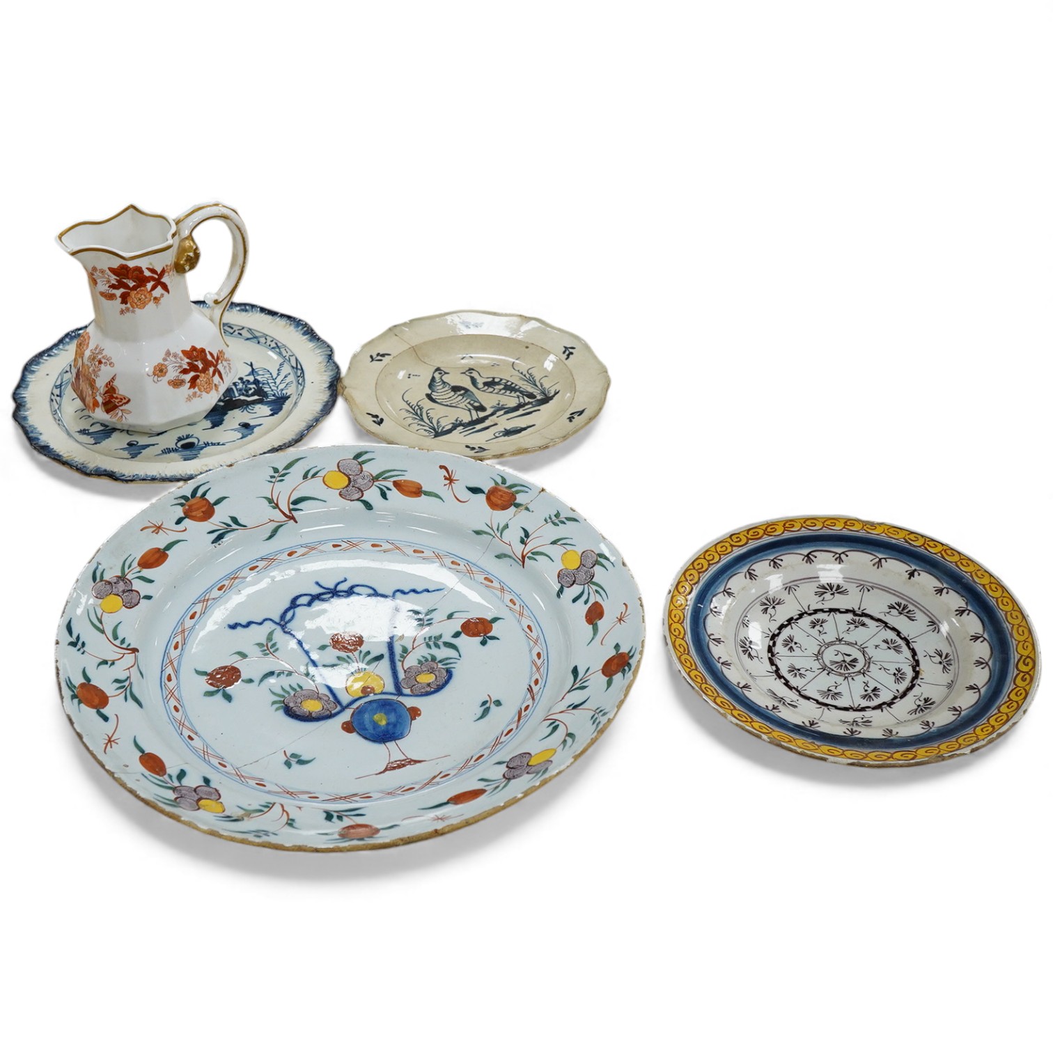 Two 18th century English delftware plates or dishes and two pearlware dishes, together with a Spode jug